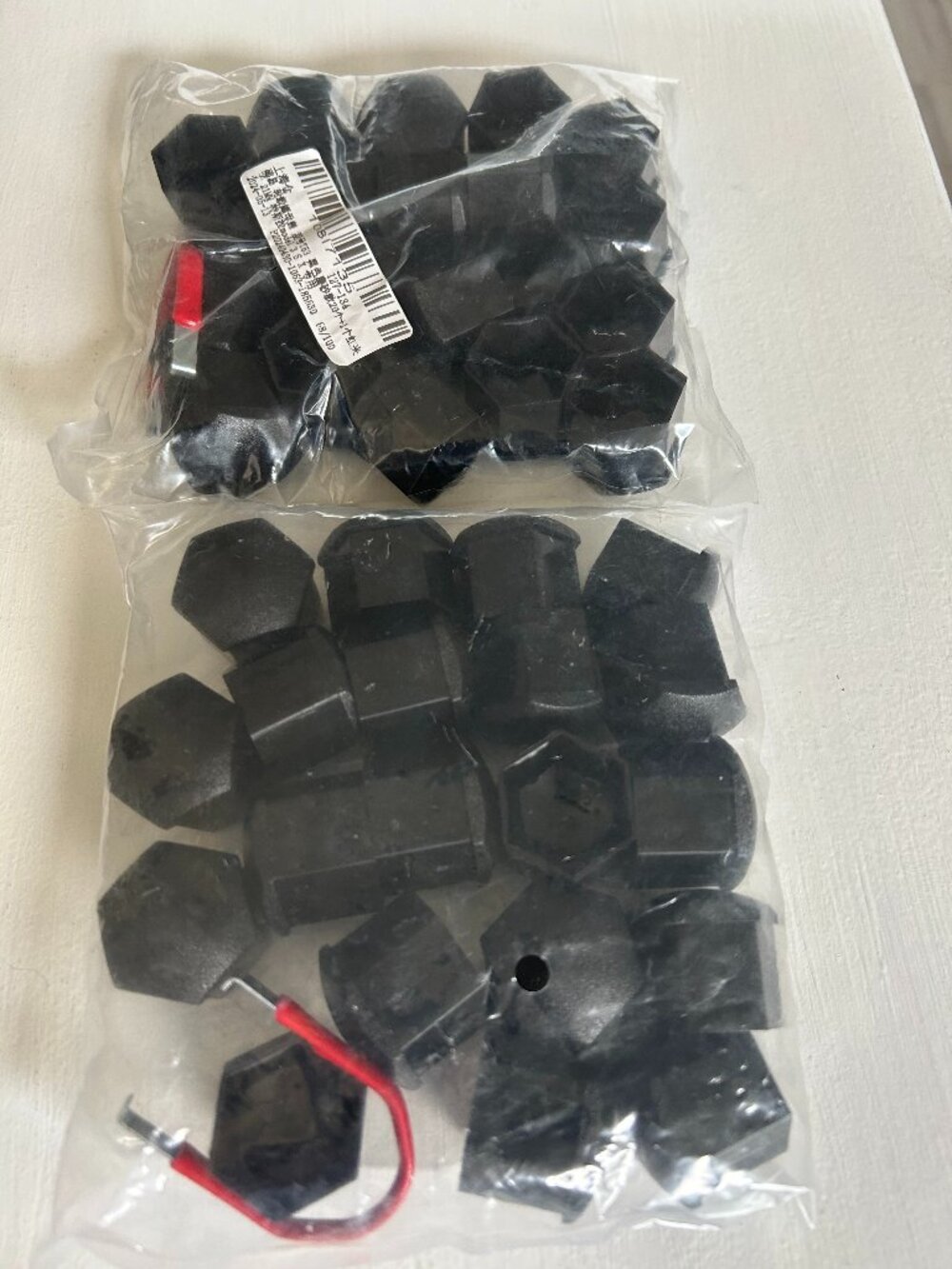 New, original package; Black Lug Nut Covers 21 mm, 2 packages of 20 covers
